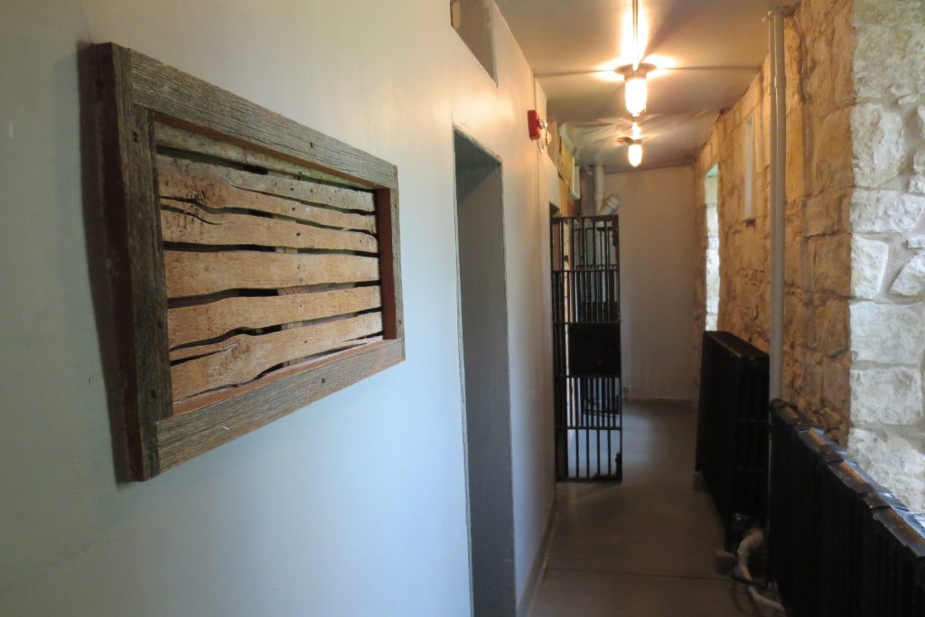 Huron Historic Gaol in Goderich showing exterior stone walls and preserved jail structure.