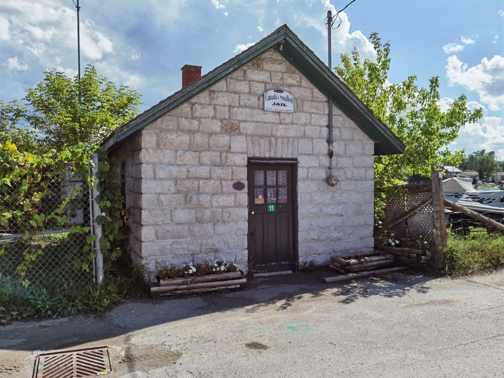 Small rural Ontario jail built of stone, typical of 19th-century communities.