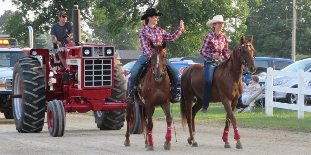 Listowel Fair Parade with two horse riders followed by a tractor