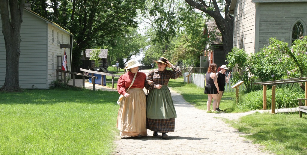 Two women walking through the village